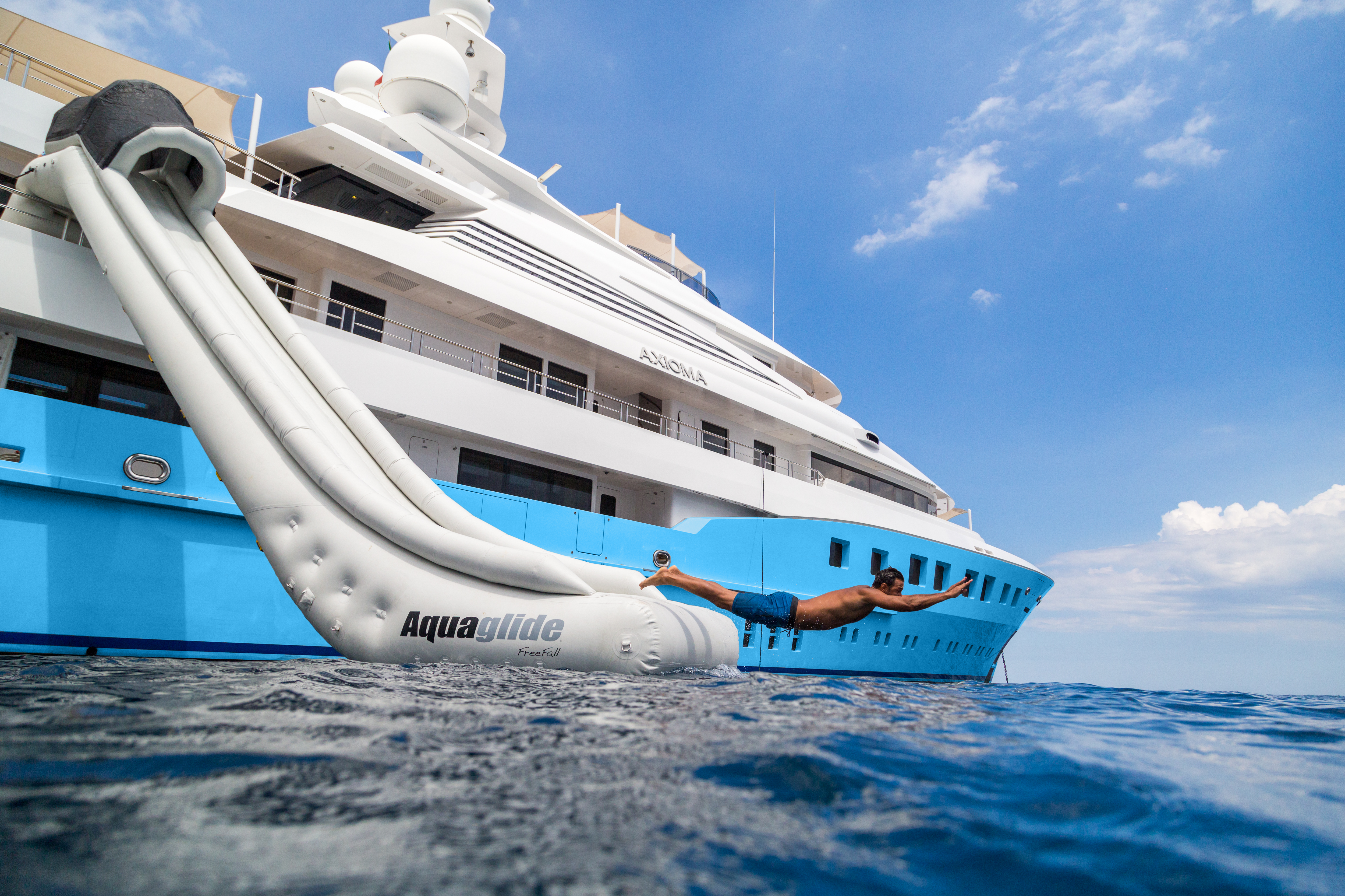 Axioma - large inflatable slide on the side of a superyacht